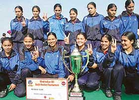 The Haryana team with the trophy after winning the 11th Surjit Memorial Hockey Tournament in Jalandhar on Wednesday
