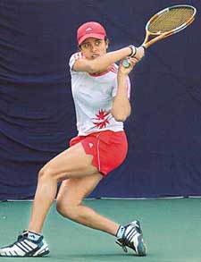 Sanaa Bhambri plays a shot against Yi-Miao Zhou of China in the girls singles final of the ITF Junior