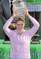 Kim Clijsters of Belgium holds the trophy after beating Lindsay Davenport of the USA in the final of the Champions Challenge 2006 in Hong Kong