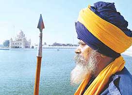 A Nihang prays on the first day of the Maghi Mela at Gurdwara Tutti Gandi Sahib in Muktsar on Wednesday.
