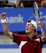 Andreas Seppi of Italy celebrates his win over defending champion Lleyton Hewitt of Australia at the Sydney International Tennis Tournament on Thursday