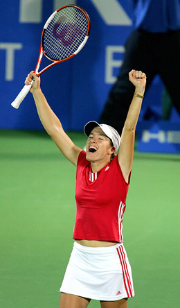 Justine Henin-Hardenne of Belgium celebrates after defeating Francesca Schiavone of Italy during the women�s singles final at the Sydney International Tennis Tournament on Friday