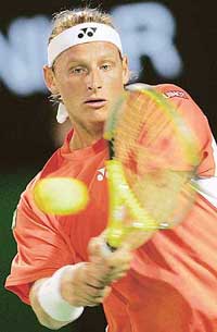Argentina�s David Nalbandian hits the ball during a second round match against Swiss player Stanislas Wawrinka at the Australian Open in Melbourne on Wednesday