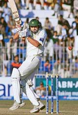 Pakistan�s Shahid Afridi plays a shot off the bowling of Zaheer Khan on the first day of the second Test at the Iqbal Stadium in Faisalabad on Saturday