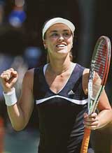 Martina Hingis celebrates after defeating Iveta Benesova