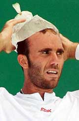 Peru�s Luis Horna cools himself with ice during a break between games during an Australian Open third round match against France�s Paul-Henri Mathieu in Melbourne on Saturday