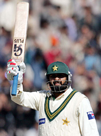 Inzamam-ul-Haq raises his bat on completing a century on the second day of the second Test against India in Faisalabad on Sunday.