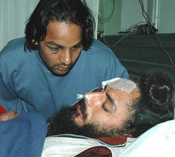 Chandigarh Dynamos captain Rajpal Singh, who was injured in a road mishap in Chandigarh, with Inderjeet Chadha at Fortis Hospital in Mohali on Sunday.