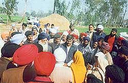 The Shiromani Akali Dal President, Mr Parkash Singh Badal, meets farmers evicted from their land in Kashipur, Uttaranchal, on Monday.