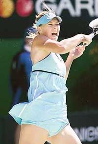 Maria Sharapova of Russia hits a return against compatriot Nadia Petrova at the Australian Open on Tuesday. 