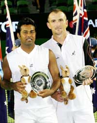 Leander Paes and the Czech Republic�s Martin Damm hold the runners-up trophies after losing to Bob Bryan and Mike Bryan of the USA in the men�s doubles final at the Australian Open in Melbourne on Saturday