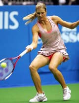 Maria Kirilenko of Russia returns a forehand to Mara Santangelo of Italy at the Pan Pacific Open tennis tournament in Tokyo