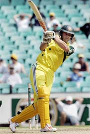 Adam Gilchrist of Australia hits a boundary during an ODI against South Africa in Sydney