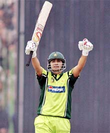 Pakistani opener Salman Butt celebrates on scoring a century against India during the first one-dayer at the Arbab Niaz Stadium in Peshawar