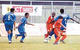 Dempo Sports Club�s Bolaji Majeck (No. 2) being challenged by JCT�s Marcos Pereira (No. 16) and Baldeep Singh during a National Football League match in Ludhiana