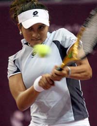 Sania Mirza returns the ball during her match against Tatiana Golovin of France at the Paris Open on Friday.