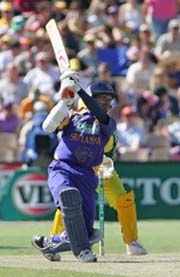Sri Lanka�s Kumar Sangakkara hits a boundary during the first final against Australia in Adelaide on Friday. 