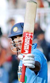 Yuvraj Singh waves his bat after scoring a half century against Pakistan during the second one-day International at the Pindi Cricket Stadium in Rawalpindi, on Saturday. Left-hander Yuvraj smashed an impressive unbeaten 82 to help India beat Pakistan by seven wickets.