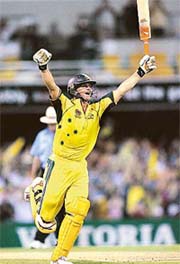 Australian batsman Adam Gilchrist is jubilant after reaching his century during the third triangular one-day series final against Sri Lanka in Brisbane