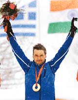 Estonia�s Andrus Veerpalu celebrates on the podium after winning the men�s 15 km cross country race at the Winter Olympic Games in Pragelato, Italy