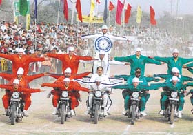 Motorcyclists from the Punjab Police Academy, Phillaur, display their skills during the 71st Kila Raipur Sports Festival