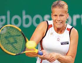 Melinda Czink of Hungary plays a return to her Ukrainian opponent Alona Bondarenko during the quarterfinal of the WTA Bangalore Open