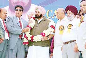 Punjab Chief Minister  Capt Amarinder Singh is garlanded by Punjab Minister Avtaar Henry at a function organised by industrialists  in Jalandhar on Sunday.