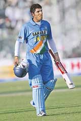 Yuvraj Singh leaves the field after guiding India to victory in the fifth one-dayer against Pakistan in Karachi on Sunday