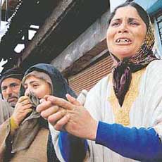 A woman cries during a protest on Thursday against the killing of four boys in Handwara.