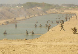 Army jawans in simulated conditions demonstrate preparedness for nuclear, biological and chemical warfare somewhere in the western sector on Tuesday.