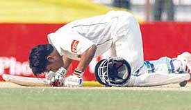 Mohammad Ashraful of Bangladesh prostrates himself after scoring a century on the first day of the first Test against Sri Lanka in Chittagong