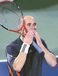 Andre Agassi of the USA celebrates after beating Greg Rusedski of the UK in the Dubai Open tournament on Tuesday