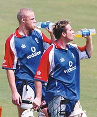 England�s Andrew Flintoff and Ian Blackwell take a drinks break during a practice session in Nagpur on Tuesday