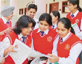 Class XII students of Patel Public School, Rajpura, discuss their question paper after taking the CBSE exam.