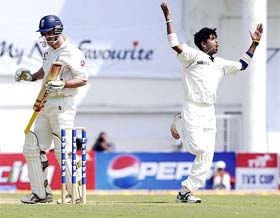 S. Sreesanth celebrates on dismissing England�s Andrew Strauss on the first day of the first Test at the VCA Stadium in Nagpur