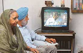 Manjit Kaur and Hari Singh, grandparents of Monty Panesar, watch the proceedings on the second day of the first Test, between India and England, in Ludhiana on Thursday. 