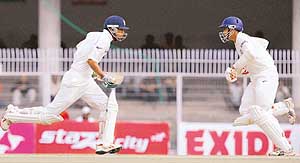 Mohammad Kaif and Anil Kumble run between the wickets during the third day of the first Test against England at the VCA Cricket Ground in Nagpur on Friday