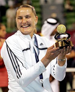 Nadia Petrova of Russia holds the winner�s trophy after beating Amelie Mauresmo of France in the final of the Qatar Open tennis tournament in Doha on Saturday