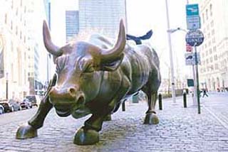 The famous landmark of The Charging Bull statue stands in front of the New York Stock Exchange