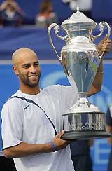 James Blake of the USA holds the trophy after beating Lleyton Hewitt of Australia in the final of the Tennis Channel Open in Las Vegas on Sunday