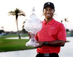 Tiger Woods holds the trophy after winning the Doral Championship golf tournament in Miami, Florida, on Sunday