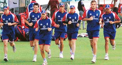 English cricketers run during a practise session at the PCA ground in Mohali on Tuesday