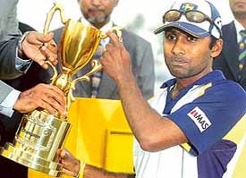 Sri Lankan captain Mahela Jayawardene holds the winners� trophy after his team beat Bangladesh in the second Test in Bogra on Saturday. Lanka won by 10 wickets to sweep the two-Test series 2-0.