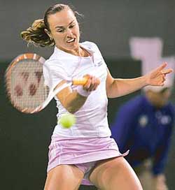 Martina Hingis of Switzerland hits a forehand against Camille Pin of France at the Pacific Life Open tennis tournament in Indian Wells, California, on Friday. Hingis won 6-1, 6-3. 