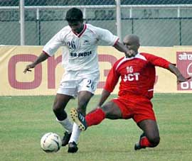 Air-India�s Soccor Velho (left) tries to get past JCT�s Marcos Pereira during a National Football League match at Guru Nanak Stadium in Ludhiana on Sunday. JCT won 2-1.