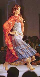 A model walks the ramp at a fashion show organised by the Bharat Chamber of Commerce in Kolkata on Sunday night. A number of upcoming designers showcased their collections in the show. 