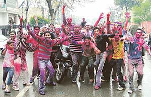 A group of boys celebrate Holi in their own style in Ludhiana on Tuesday.