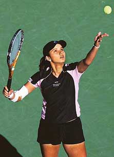 Sania Mirza serves to Elena Dementieva of Russia during the Pacific Life Open in Indian Wells, California, on Monday