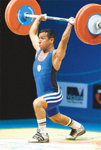 Vicky Batta performs a lift in men�s weightlifting at the Commonwealth Games in Melbourne on Thursday
