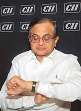 Finance Minister P. Chidambaram looks at his watch during the CII�s National Council meeting in New Delhi on Monday. 